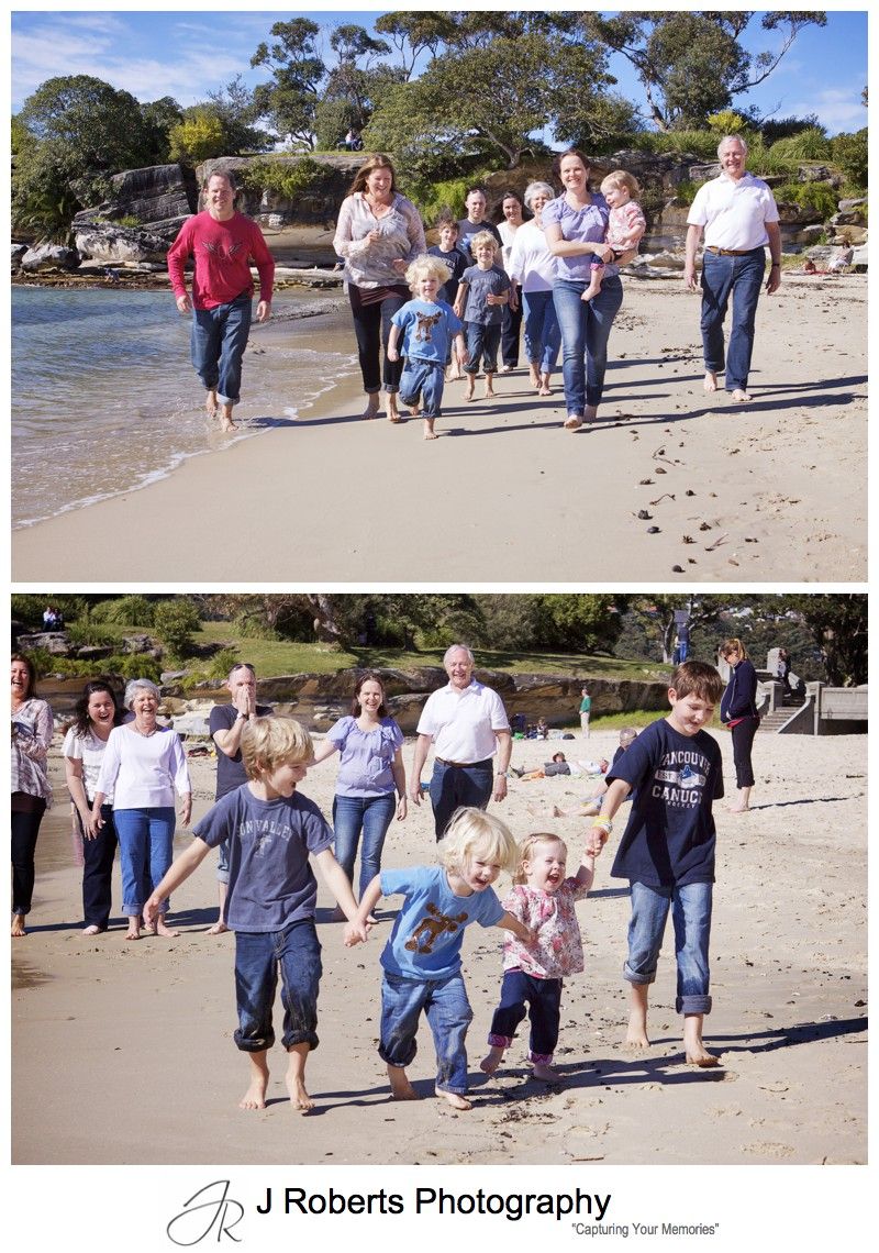 Extended family running along balmoral beach for a family portrait - family portrait photography sydney